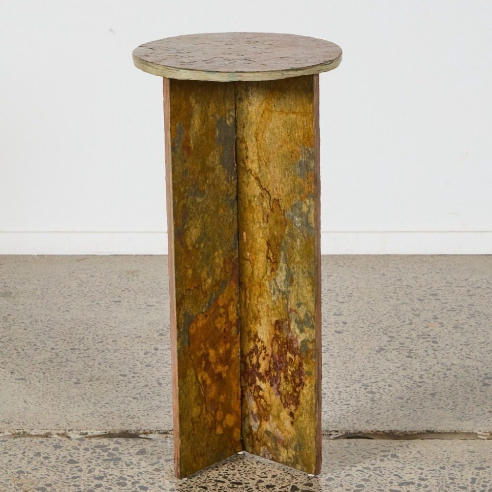 OxMont's Flagship side table, a round rust and ochre slate top on a raw stone base