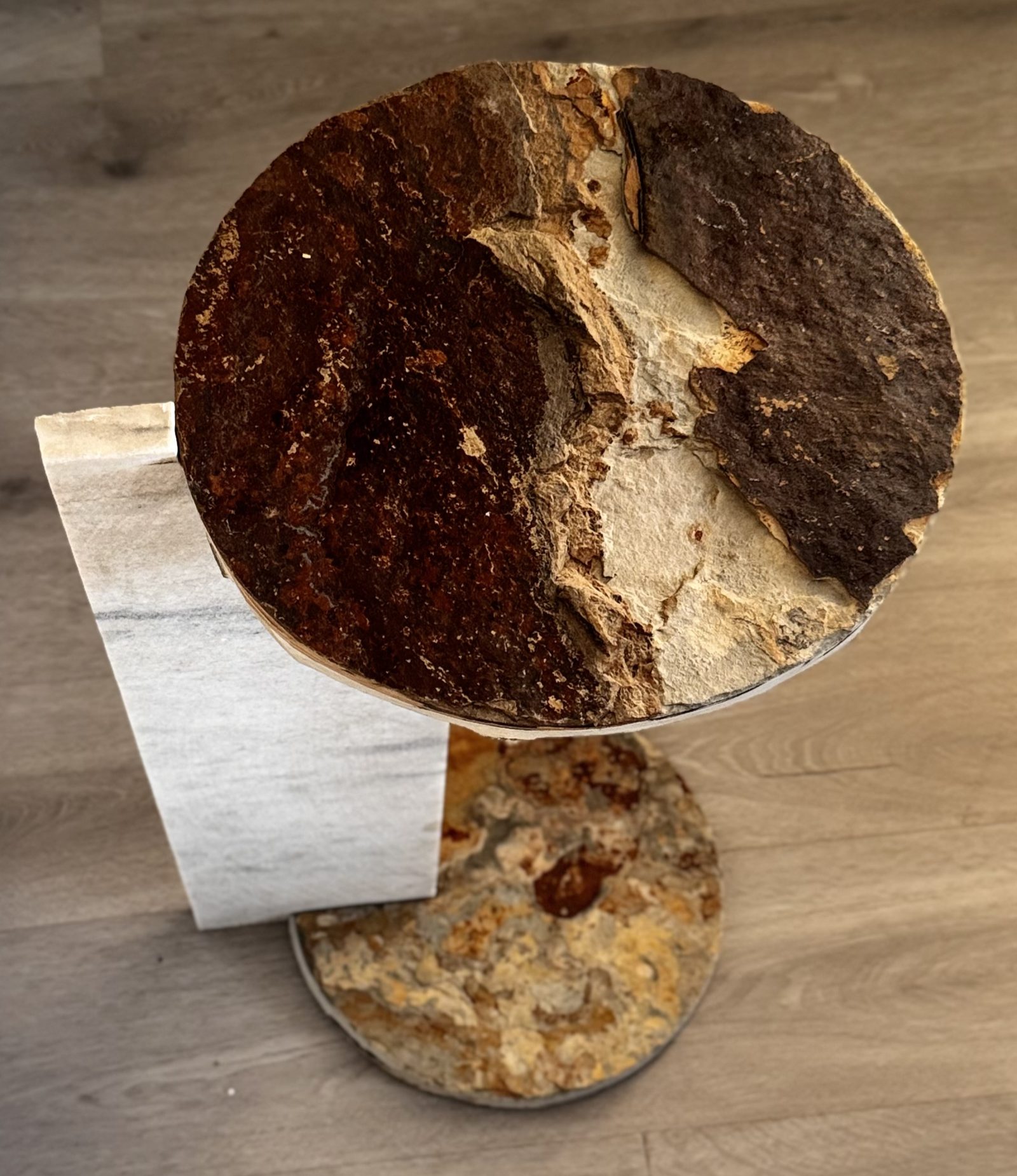 OxMont's Round Reach side table, handcrafted from natural stacked stone slate with a round natural-edge top
